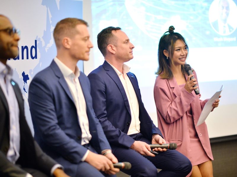 Emcee hosting a panel discussion on stage
