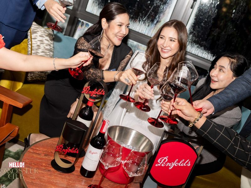 Guests toasting with wine at the Prestige High Flyers Club event