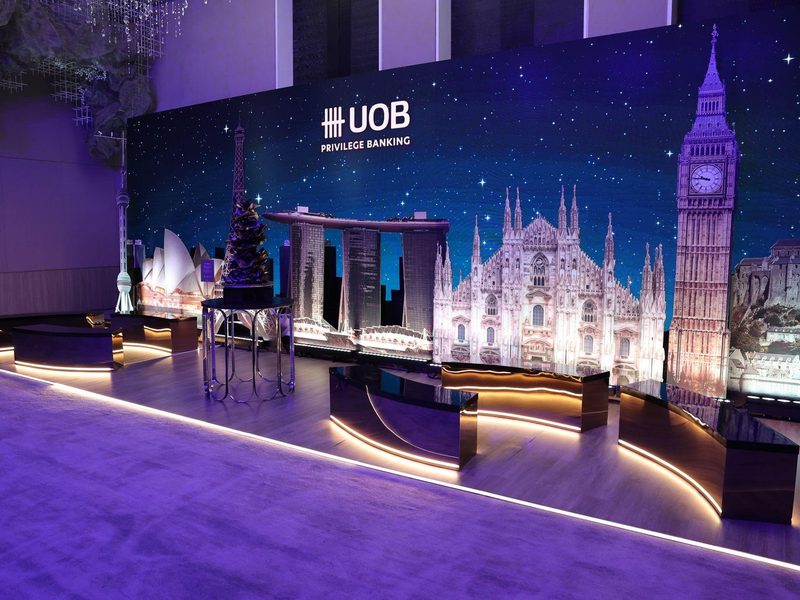 UOB Privilege Banking booth wide shot with landmark LED wall and lounge seating